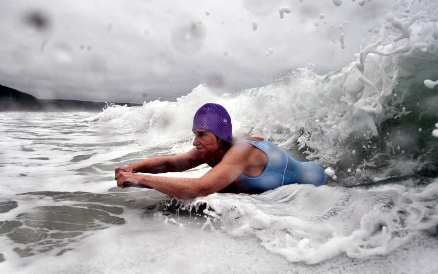 This is Gwyn Haslock, aged 67.  She has won numerous UK national titles and still is a top stand up surfer, but she love belly boarding just as much.  